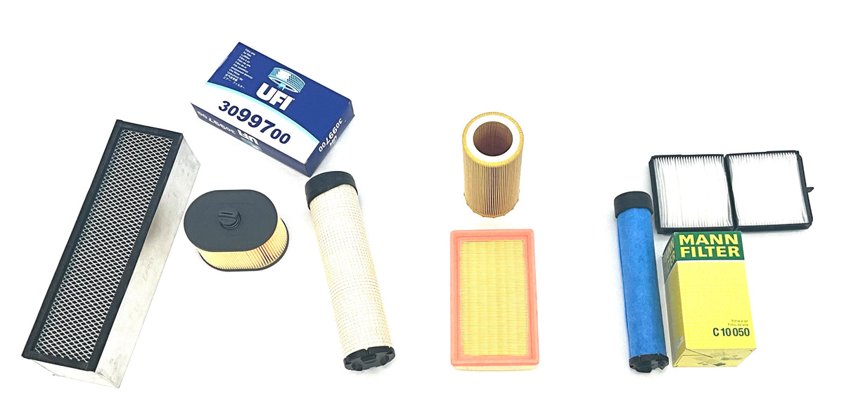 A set of air filter and their packaging boxes arranged on a plain white background, including a rectangular charcoal filter, a round black-top cartridge filter, a blue cylindrical filter, a yellow pleated air filter, and a Mann Filter box, arrange to spell the word 'Air'.