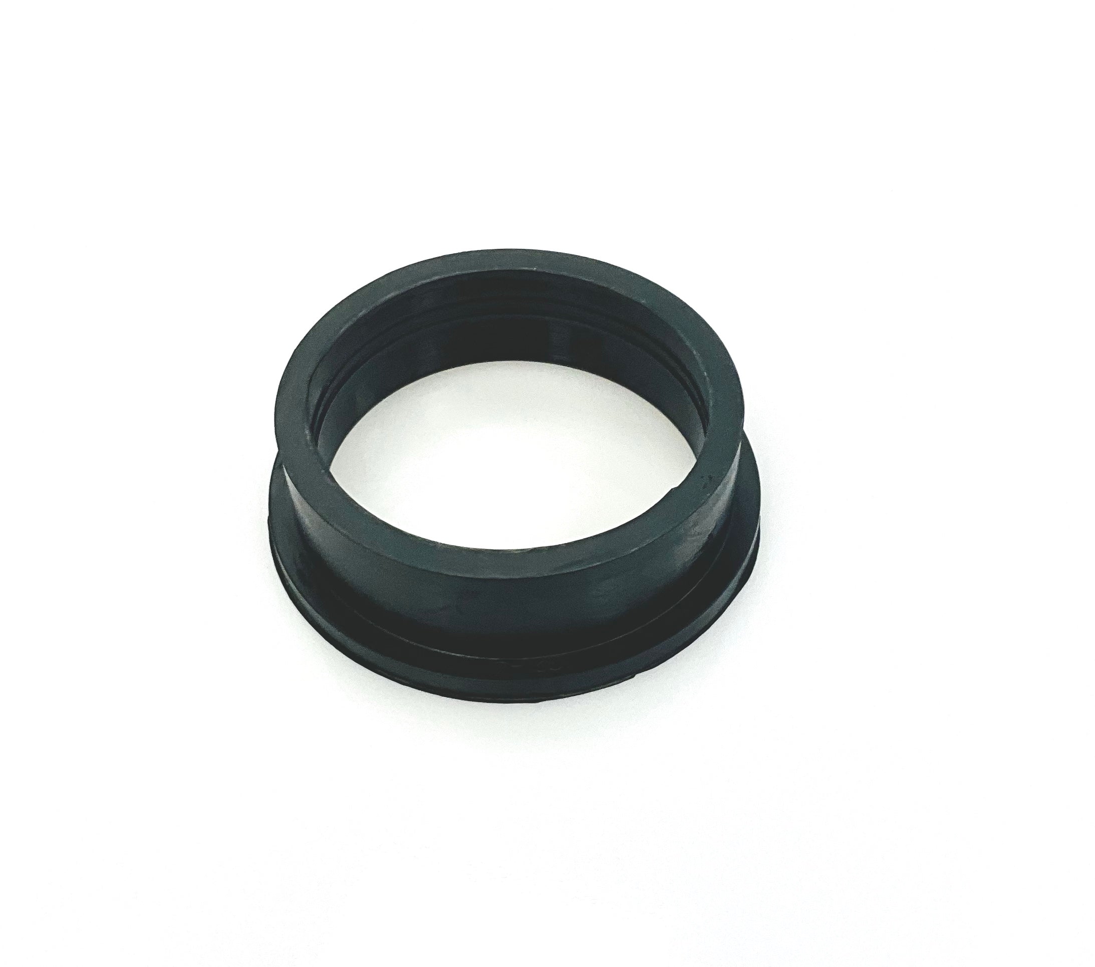 A black cylindrical ring-shaped rubber insert, photographed on a white background.