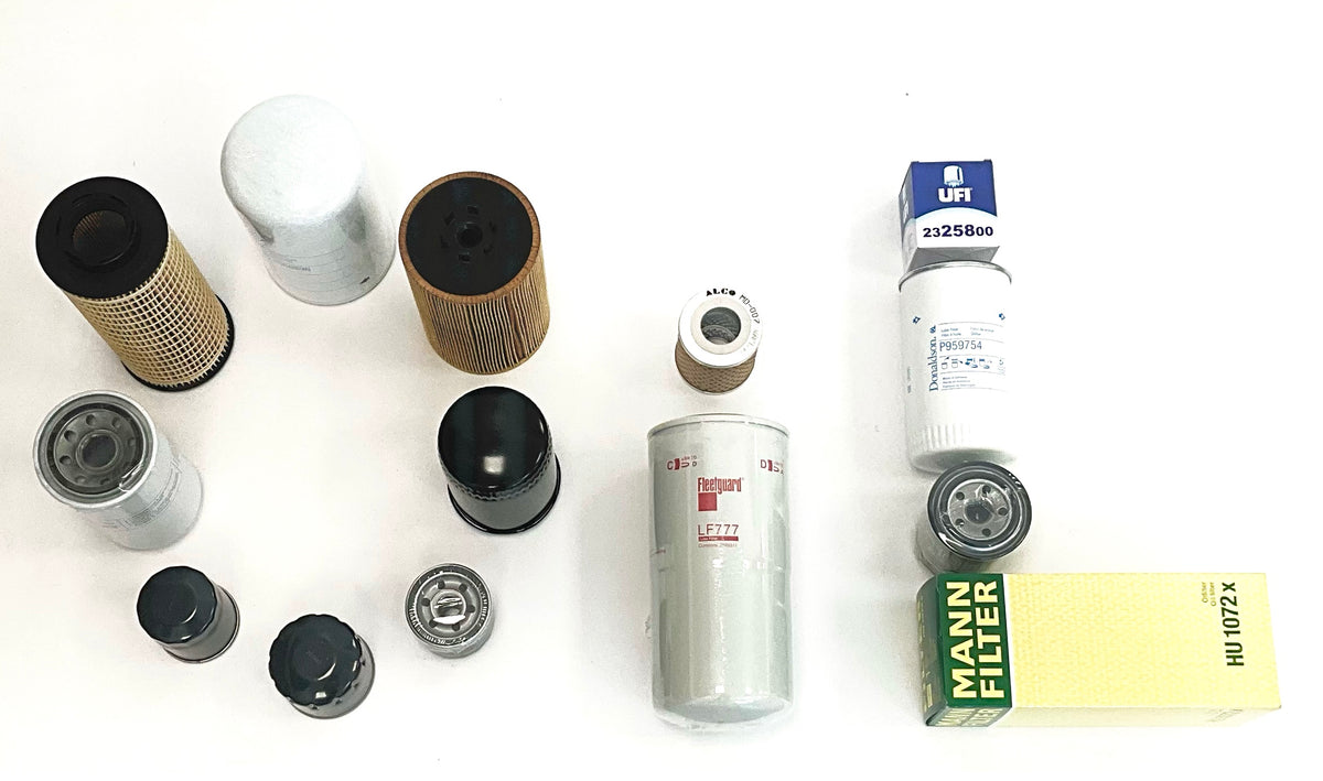 A collection of heavy duty oil filters, and a Main Filter box arranged on a plain white background, arrange to spell the word 'Oil'.
