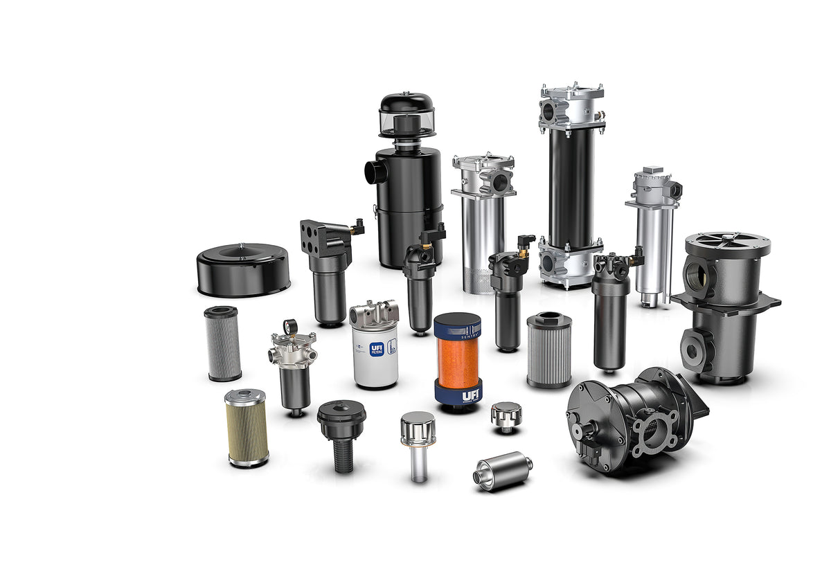 Collection of hydraulic circuit components, photograph on a white background.